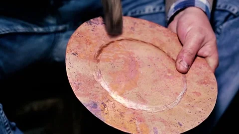 Traditional tinsmith work. Copper smith makes embossing artifacts from copper. D Stock Footage 76442644