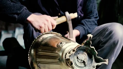 Traditional tinsmith work. Copper smith makes embossing artifacts from copper. D Stock Footage 76442672