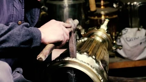 Traditional tinsmith work. Copper smith makes embossing artifacts from copper. D Stock Footage 76442690
