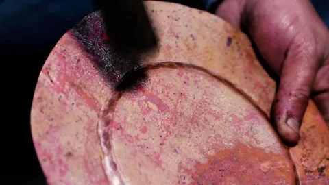 Traditional tinsmith work. Copper smith makes embossing artifacts from copper. D Stock Footage 76442705