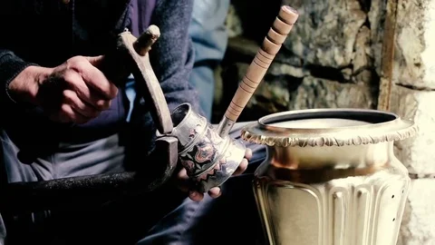 Traditional tinsmith work. Copper smith makes embossing artifacts from copper. D Stock Footage 76442837