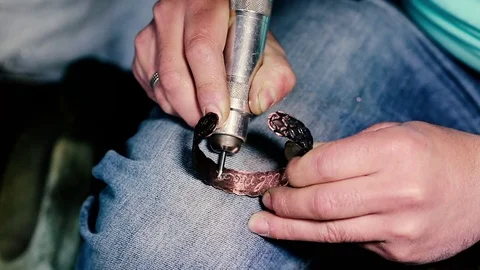 Traditional tinsmith work. Copper smith makes embossing artifacts from copper. D Stock Footage 76442921
