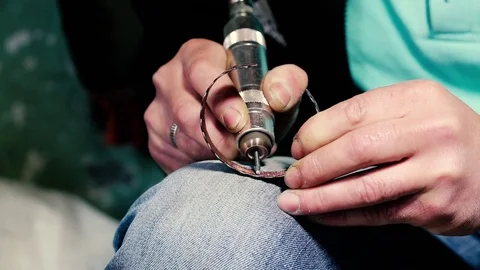 Traditional tinsmith work. Copper smith makes embossing artifacts from copper. D Stock Footage 76442933