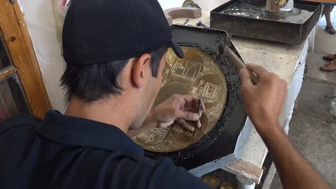 Traditional tinsmith work. Copper smith makes embossing artifacts from copper Stock Footage 128025682