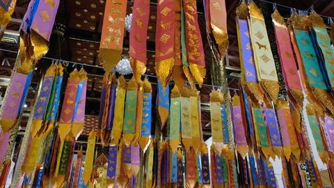 Traditional Tung prayer flags inside Thai temple Stock-Fotos