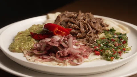 Traditional Turkish dish with pulled meat, salad, and spicy pepper Stock Footage 336611180