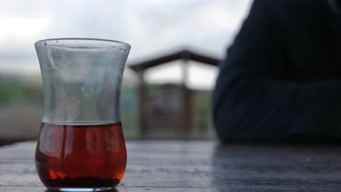 Traditional Turkish Tea inside the slim waist glass Stock Footage 190639251