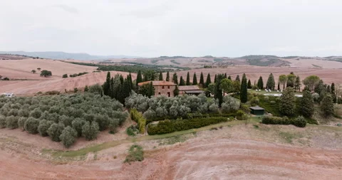 Traditional Tuscan villa surrounded by cypress trees Stock Footage 303307662