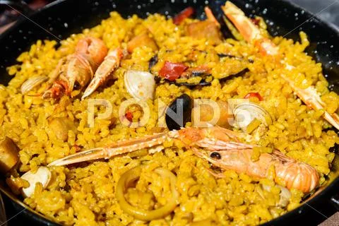 Traditional Valencian Paella With Rice And Seafood Stock Photos