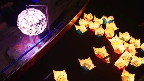 Traditional Vietnamese Lanterns Floating on River Stock Footage 340376573