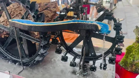 Traditional Water Wheel Model Powered by Flowing Water. Stock Footage 337371200