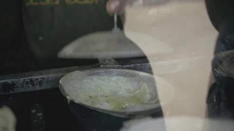 Traditional way of baking the rotti with eggs, indian food, authentic street Stock Footage 73288878