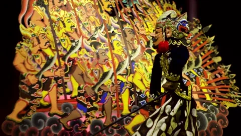 Traditional wayang golek puppet performing opposite colorful painted army b.. Stock Footage 344791966