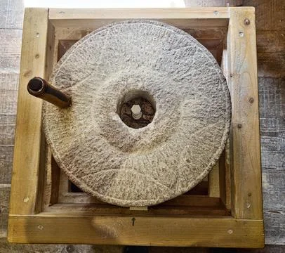 Traditional wheat grinder made of 2 flat, coarse stones also known as , Vis.. Stock Photos