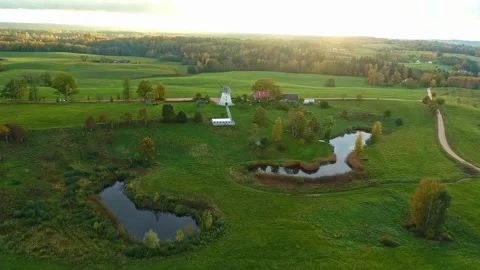 Traditional white windmill in the autumn colored nature during a sunset. Stock Footage 234848945