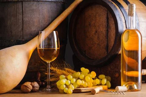 Traditional white wine and barrels Stock Photos