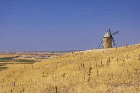 Traditional windmill overlooking the fields of Mota del Cuervo in Castille .. Stock Photos