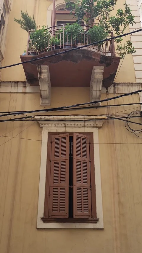 Traditional window with brown shutters on an old building in Tripoli, Lebanon Stock Footage 314040053
