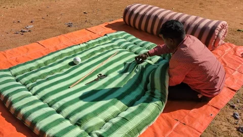 Traditional winter quilt making in progress by local in rural Bengal India Stock Footage 313485840