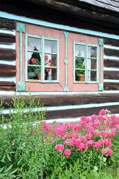 Traditional wooden house and a garden Stock Photos