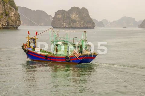 Traditional wooden junk in Ha Long Bay Vietnam Stock Photos