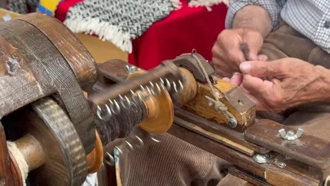 Traditional Wool Spinning by Elderly Artisan on Vintage Machine. Stock Footage 337325115