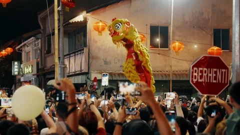 Traditional Yellow Lion Dance Performance on High Poles at Chinese New Year Stock Footage 328509052