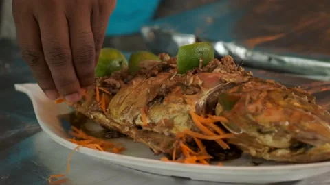 Traditionally cooked fish lies in a Dish and delicious sauce  Stock Footage 139500226