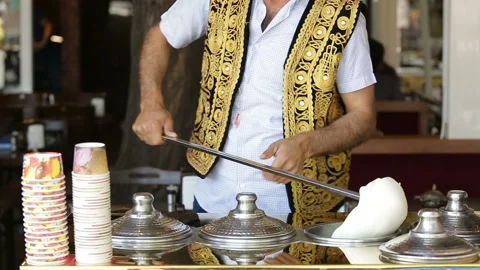 Traditionally dressed man prepare Turkish ice cream in Istanbul streets. Stock Footage 149962465