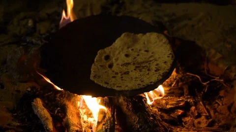 Traditionally preparing pita bread on a hot plate Stock Footage 94689235