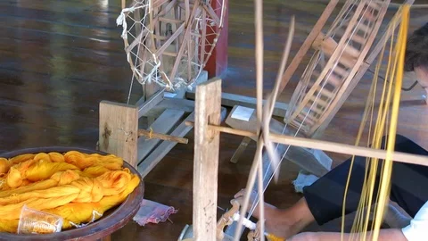 Traditionally spinning thread, Thailand Stock Footage 103349913