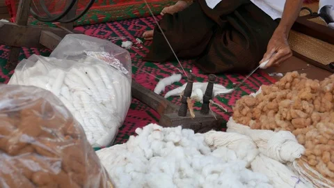 Traditionally spinning thread, Thailand Stock Footage 104657513