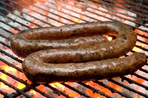 Tradtional south african braai barbecue borewors sausage on fire Stock Photos