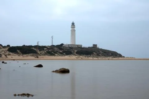 Trafalgar lighthouse reflected in the pond, cloudy Stock-Fotos