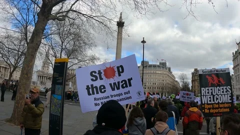 Trafalgar square column crowd with stop the war sign London ukraine Video stock 171486796