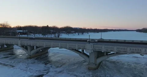 Traffic On 169 Bridge At Sunset In Winter Champlin Minnesota - Drone Truck Left Stock Footage 228894590