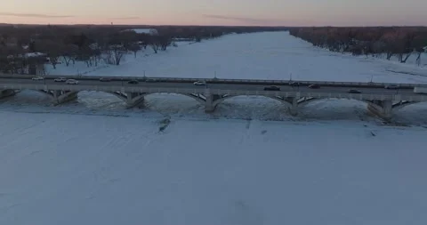 Traffic On 169 Bridge In Winter At Sunset Champlin Minnesota - Drone Orbit Stock Footage 228894619