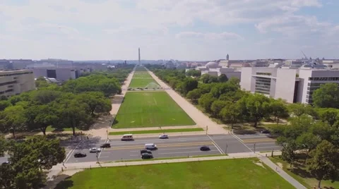 Traffic on 3rd Street across National Mall with Washington Monument Stock Footage