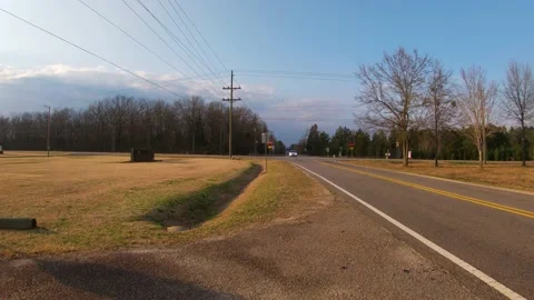 Traffic at a 4 way intersection time lapse on a beautiful evening with blue s Stock Footage 149335059