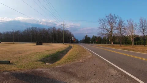 Traffic at a 4 way intersection time lapse on a beautiful evening with blue s Stock Footage 149335087