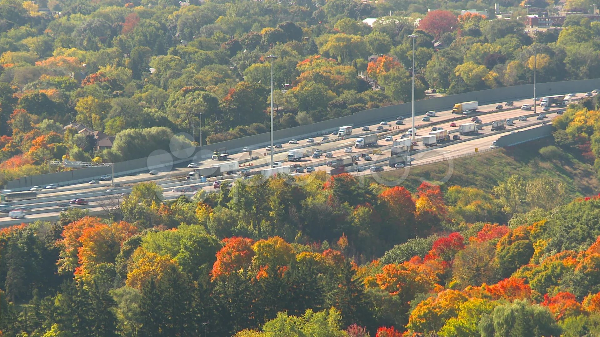 traffic on the 401 highway Macdonald Cartier Freeway autumn colours Toronto