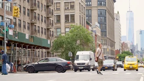 Traffic on 6th street wit guy taking a yellow cab Stock Footage 91663665