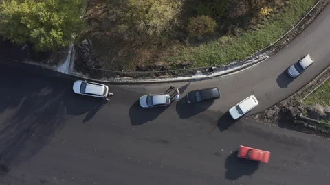 Traffic accident: Collision of two cars on the road. Aerial drone Top view Shot. Stock Footage