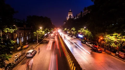 Traffic along CST train station in Mumbai downtown, India time lapse at night Stock Footage 119138404