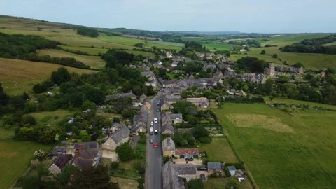 Traffic Along Main Road Through Compact Dorset Village Stock Footage 338163198