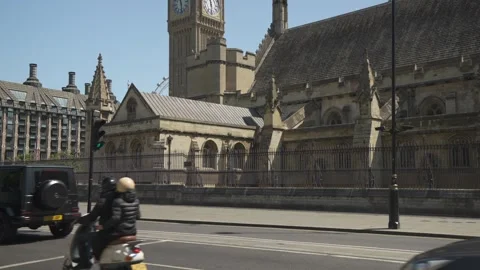 Traffic and Big Ben Clocktower in Parliament Square, London, England Stock Footage 242988404