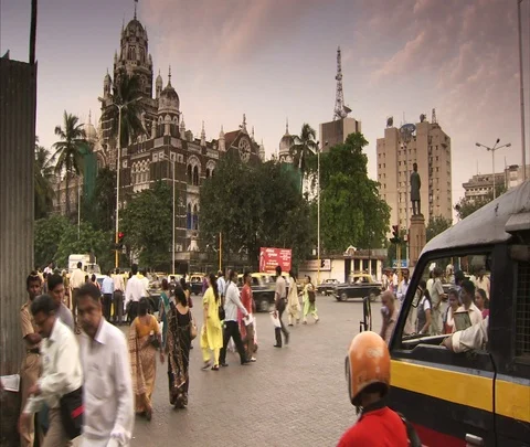 Traffic and crowds of pedestrians in front of Western Railway Headquarters Stock Footage 86742374