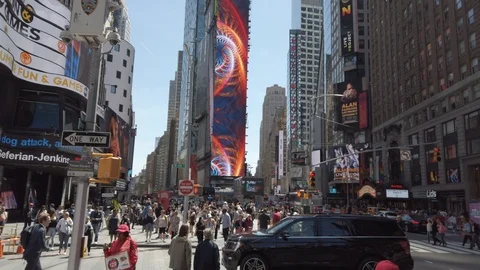 Traffic and crowds on a sun dappled afternoon in NYC's Times Square Stock Footage 111220126