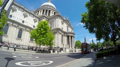Traffic and double-deckers busses passing in front of St. Paul's cathedral Stock Footage 79506137