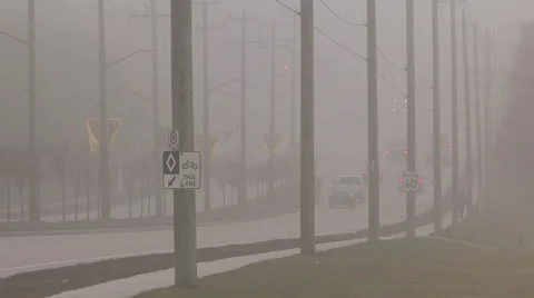 Traffic and drivers in severe heavy fog on highway Stock Footage 45014624